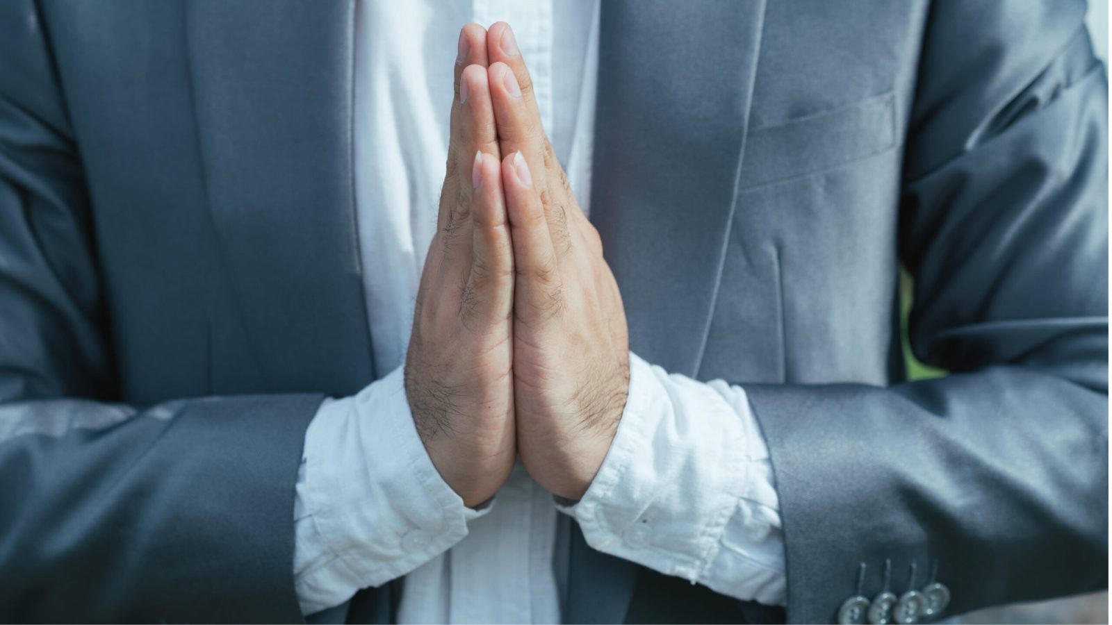 Close-up image of man making Namaste gesture with his palms
